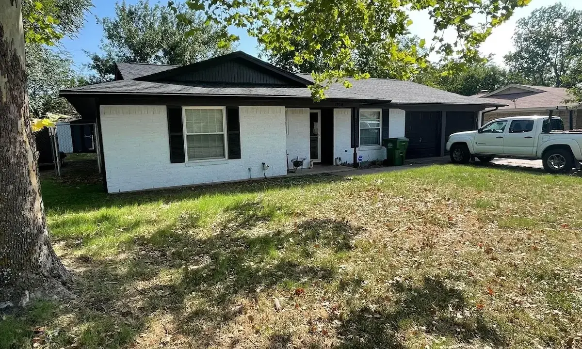 Professional roofing crew working on a residential roof in Seneca Falls